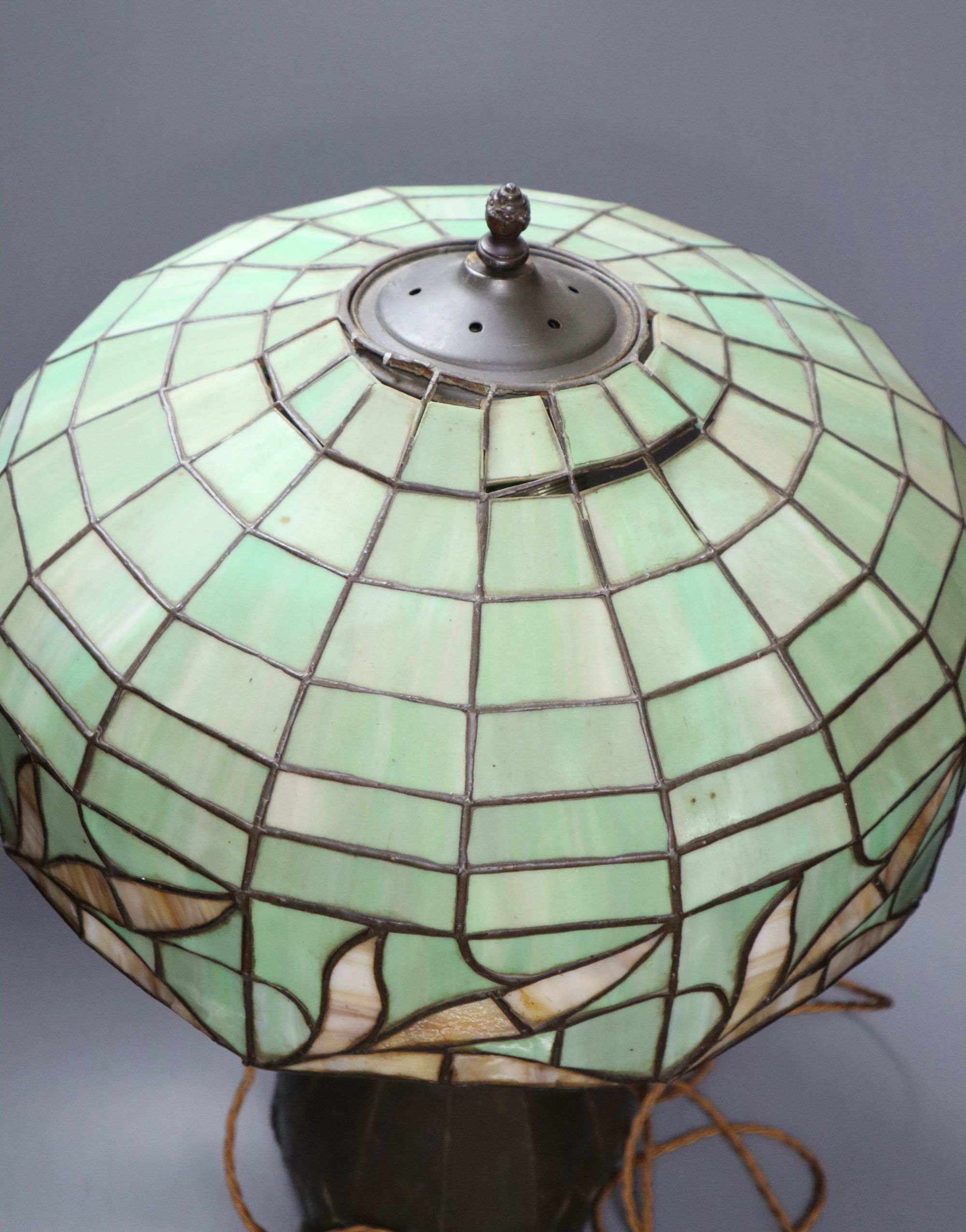 A spelter lamp with Tiffany style shade